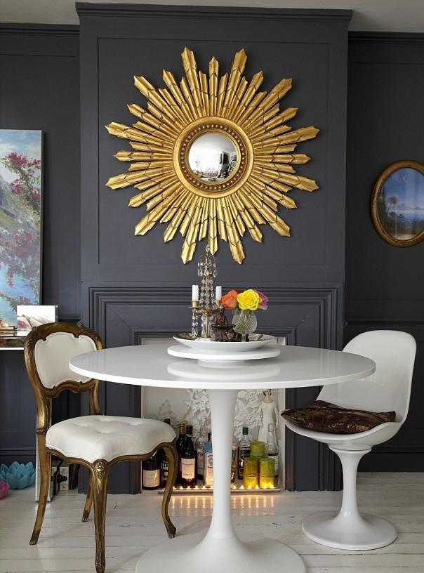 amazing-decorative-mirror-as-bright-sun-on-dark-wall-faced-fashionable-chair-and-round-white-top-coffee-table